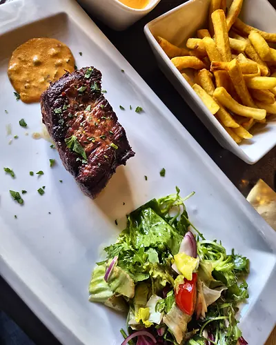 Steak with fries and salad